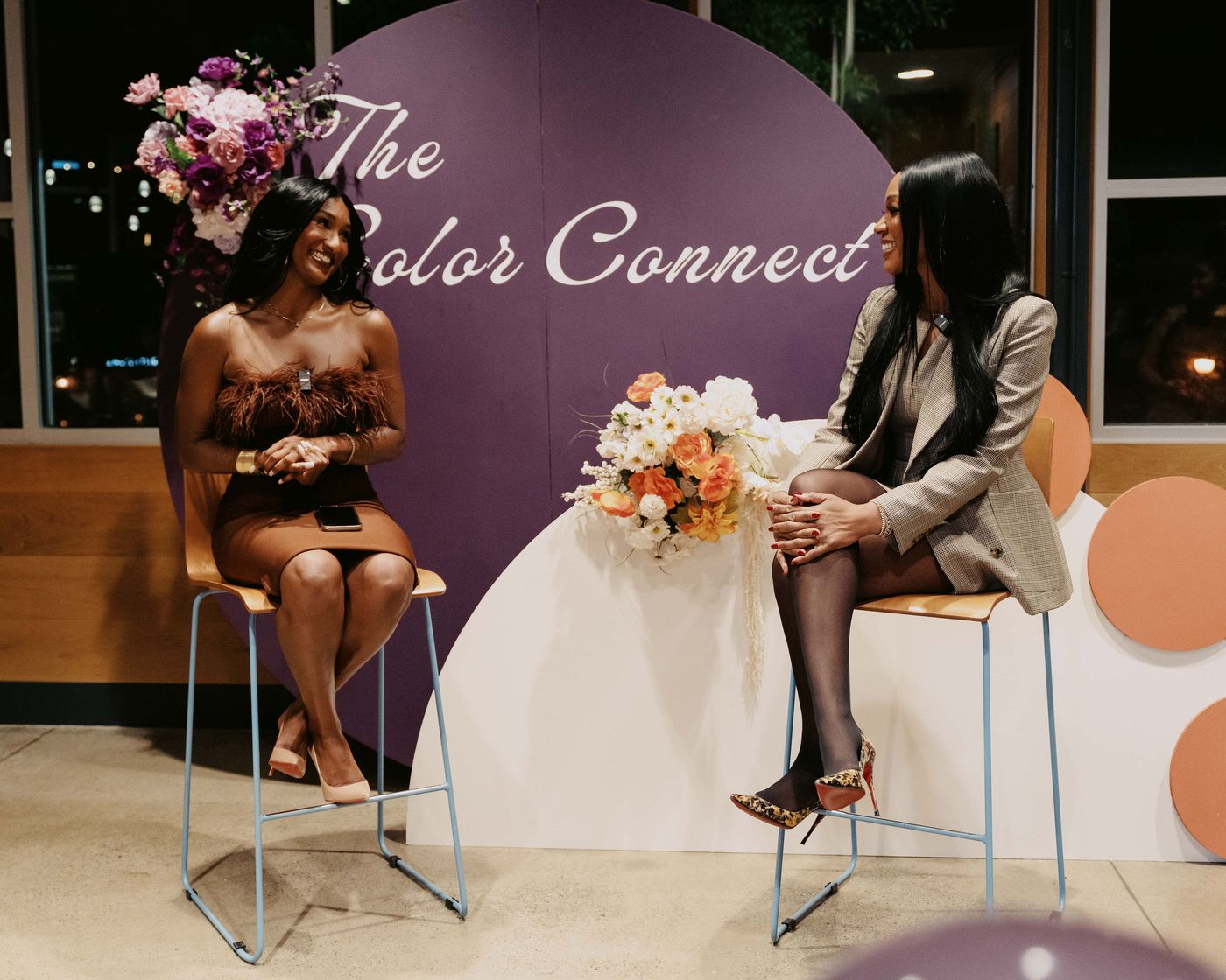 Full stage design with floral arrangements for The Color Connect event